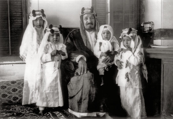 King Abdulaziz surrounded by some of his sons, including Mishaal, Talal, Nawaf, and Mutaib. King Abdulaziz Foundation for Research and Archives (Darah)