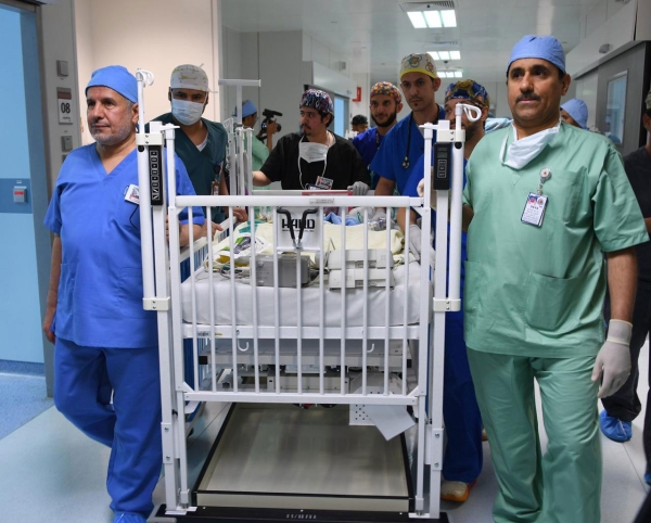 The medical team involved in one of the operations to separate conjoined twins at a hospital in the Kingdom. (SPA)