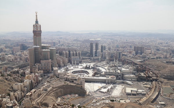 The towers of the endowment of King Abdulaziz oversee the Grand Mosque. (Saudipedia)