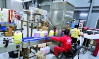 A production line in one of the cleaning materials factories in the Kingdom. King Abdulaziz Foundation for Research and Archives (Darah)