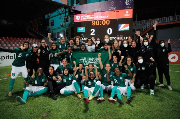 The Saudi national team players celebrate their victory against the Seychelles team. (SPA)