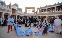 A group of children playing Taq Taq Taqiyah game (SPA).