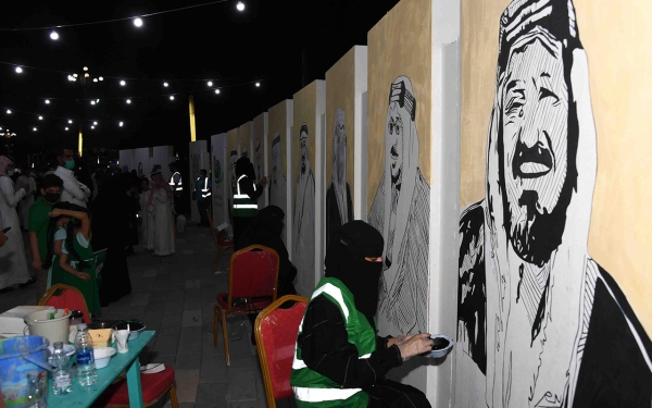 Saudi female artists painting murals of the Kingdom&#039;s kings. (SPA)