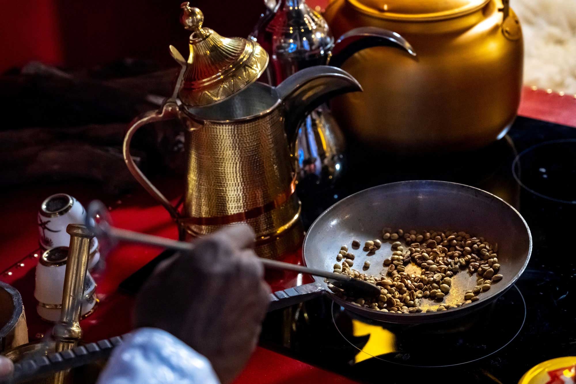 Roasting coffee beans before grinding them to prepare Saudi coffee. (SPA)