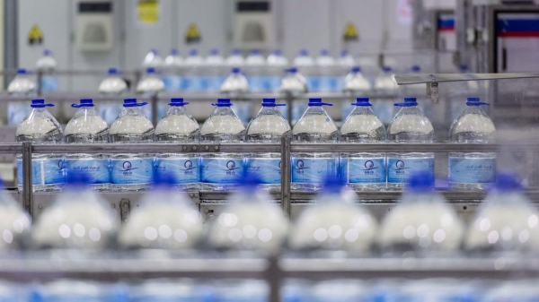 Preparing Zamzam water bottles at the filling plant in Makkah al-Mukarramah. (SPA)