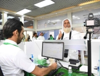 A pilgrim completing airport procedures through the Makkah Route Initiative. (SPA)