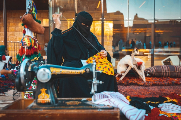 A woman practicing her craft as part of the Diriyah Gate Project. (Media Center of the Diriyah Gate Development Authority)