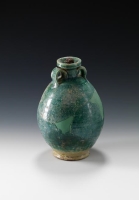 A green ceramic jar crafted from yellow pottery. (Saudi Commission for Tourism and Antiquities)