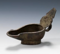 An ancient bronze oil lamp, shaped like a boat, was used for lighting. (Saudi Commission for Tourism and Antiquities)