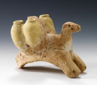A camel figurine carries five jars made of red clay on its back. (Saudi Commission for Tourism and Antiquities)
