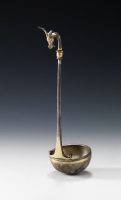 A silver ladle with a straight handle that ends in an ibex head with two horns. (Saudi Commission for Tourism and Antiquities)