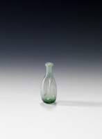 A small, transparent glass bottle dating back to the ninth century. (Saudi Commission for Tourism and Antiquities)