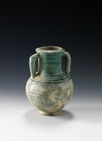 A circular vase made of coarse red clay. (Saudi Commission for Tourism and Antiquities)