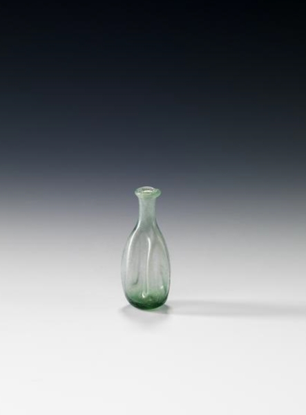 A small, transparent glass bottle dating back to the ninth century. (Saudi Commission for Tourism and Antiquities)
