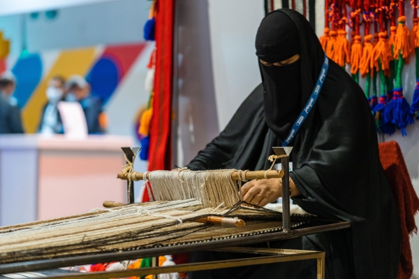 An elderly woman practicing weaving, which was historically used to produce furnishings and ship sails. (SPA)
