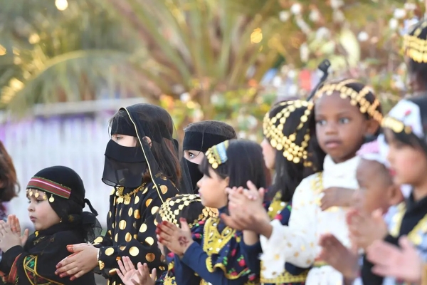 Two kids wearing Al-Burqa in celebration of the Founding Day in Tabuk Province. (SPA)