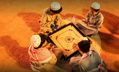 Children playing Carrom, one of the traditional games in the Kingdom. (Media Center of the Heritage Commission)