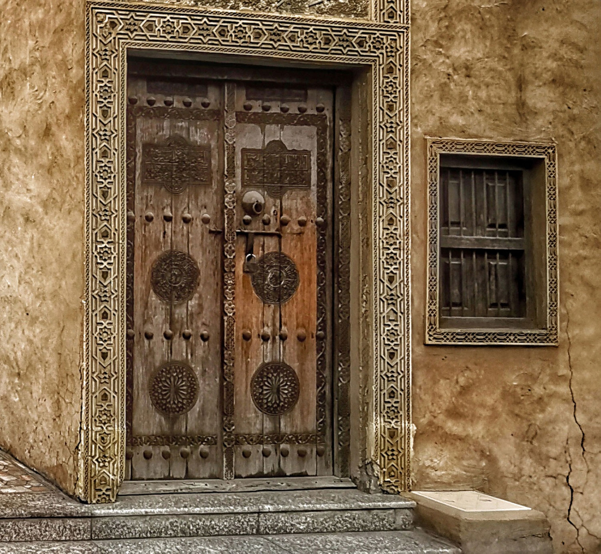 A door and window of a traditional mosque in Al-Dirah Neighborhood on Tarut Island, east of the Kingdom. (Photography: Mahdi Al-Sughayir)