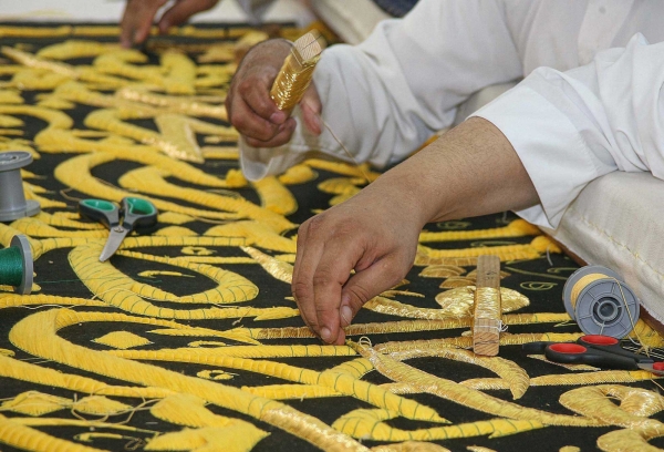 Saudi artisans embroidering the Kiswa of Al-Kaaba Al-Musharrafa in the King Abdulaziz Complex for the Holy Kaaba Kiswa in Makkah Al-Mukarramah. (SPA)